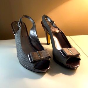 4 inch grey heels, metallic heal, soft faux suede upper. Used,still look great!